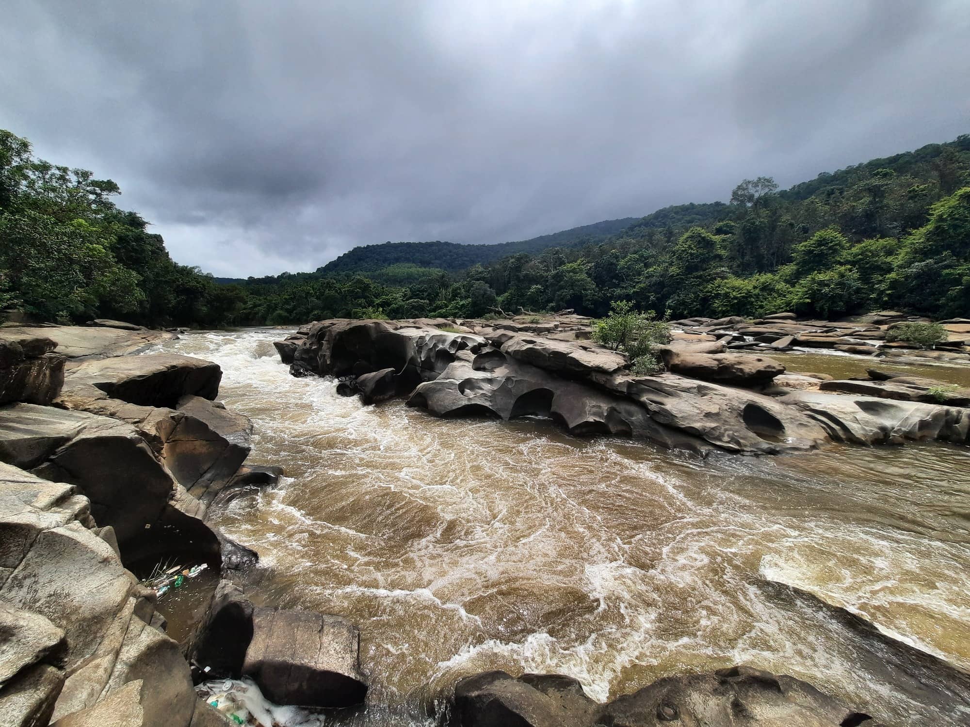 Amba Theertha river flowing over rocks. Near RiverMist Resorts.