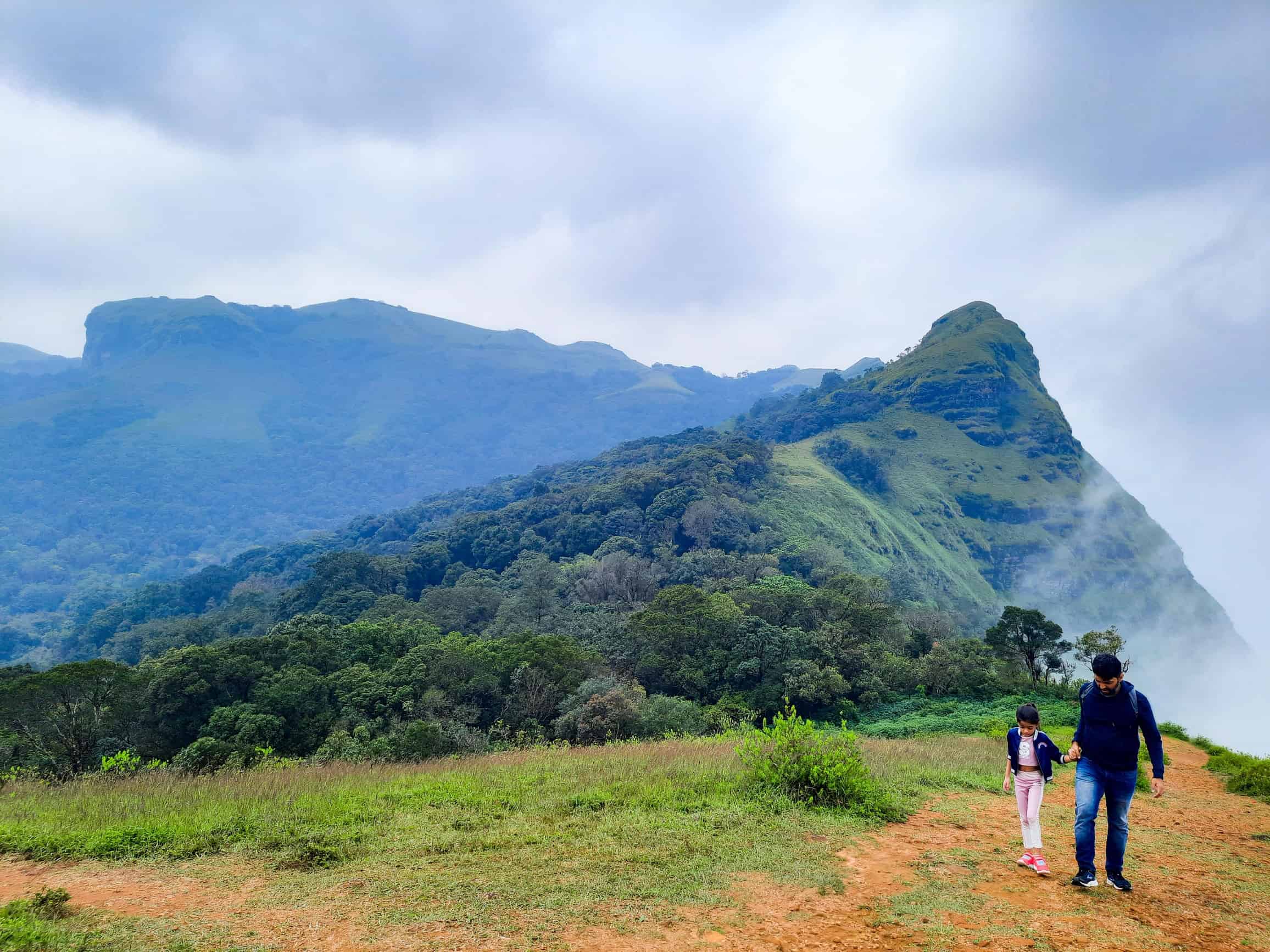 Father and child hiking path. Ballalarayana Durga, Chikmagalur.