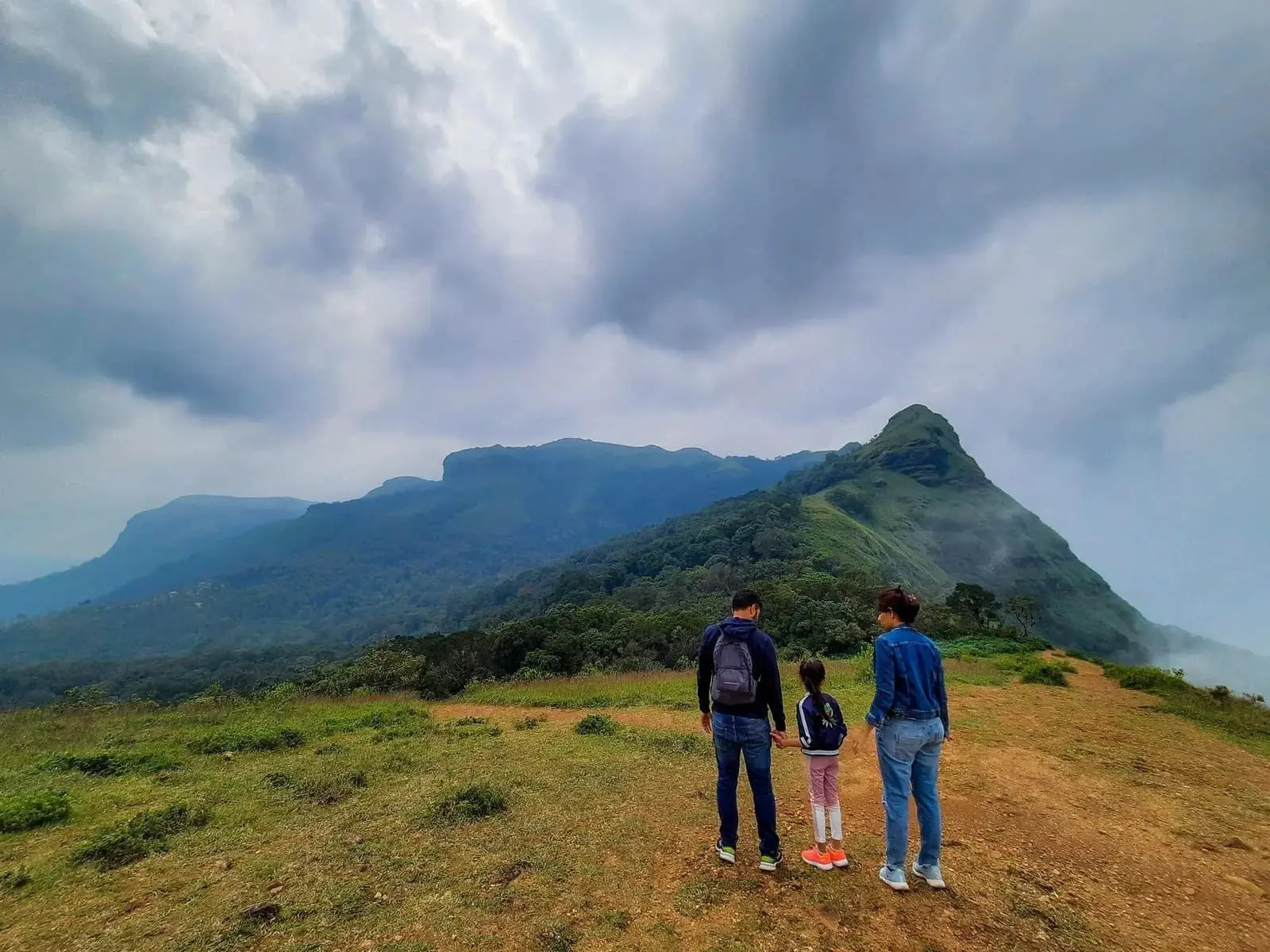 Family enjoying scenic mountain views near RiverMist Resorts
