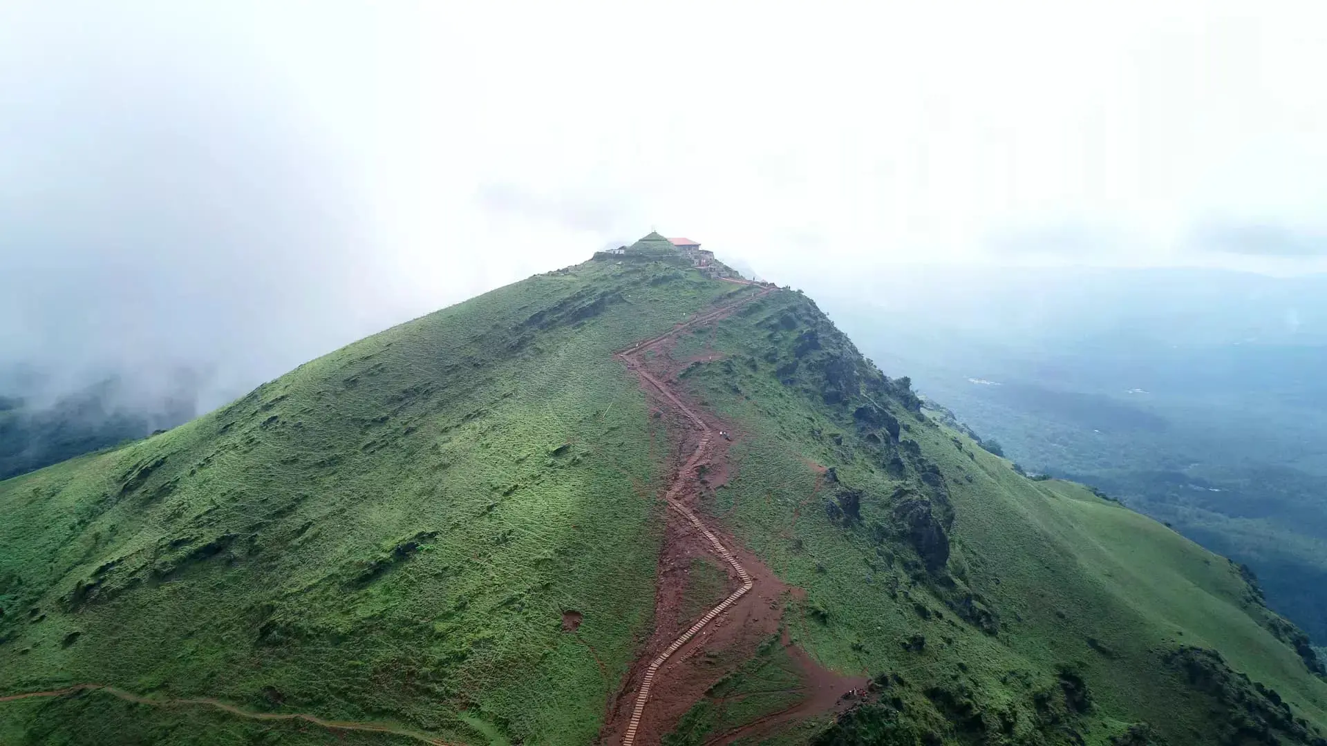 Aerial view of lush green mountain trail near RiverMist Resorts