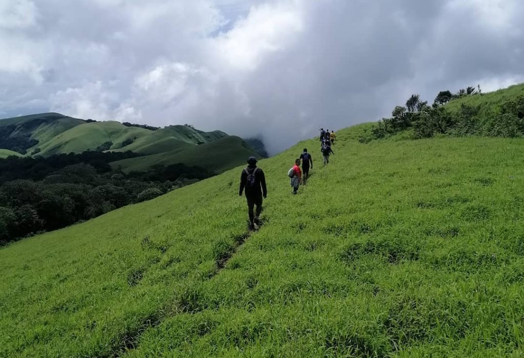 Hikers ascending mountain slope. Ballalarayana Durga, Karnataka.